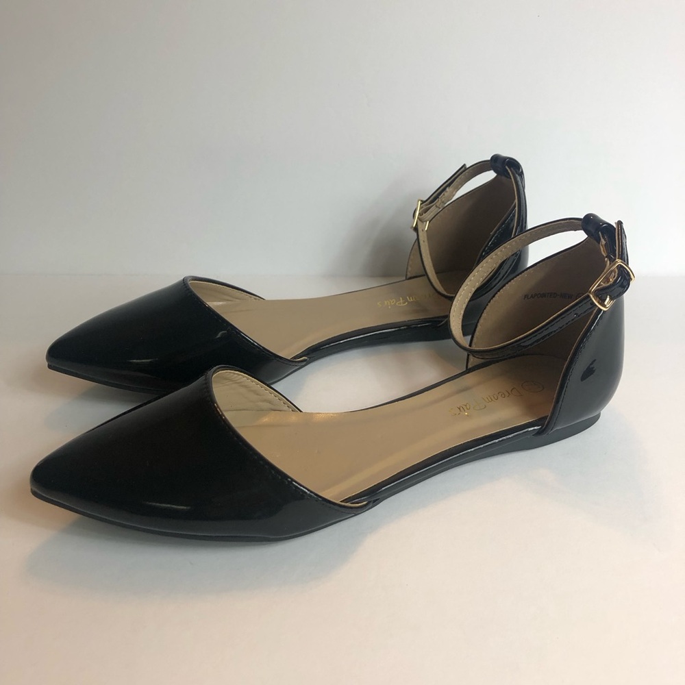 NWOT black dressy flats with pointed toe and ankle strap.